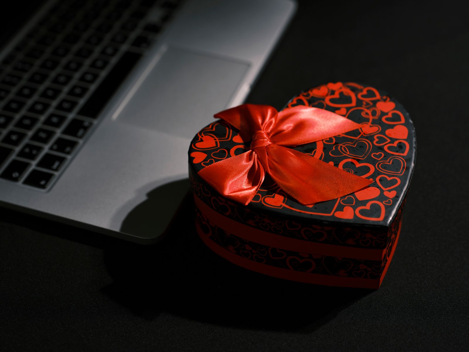 Wrapped gift box on a dark table