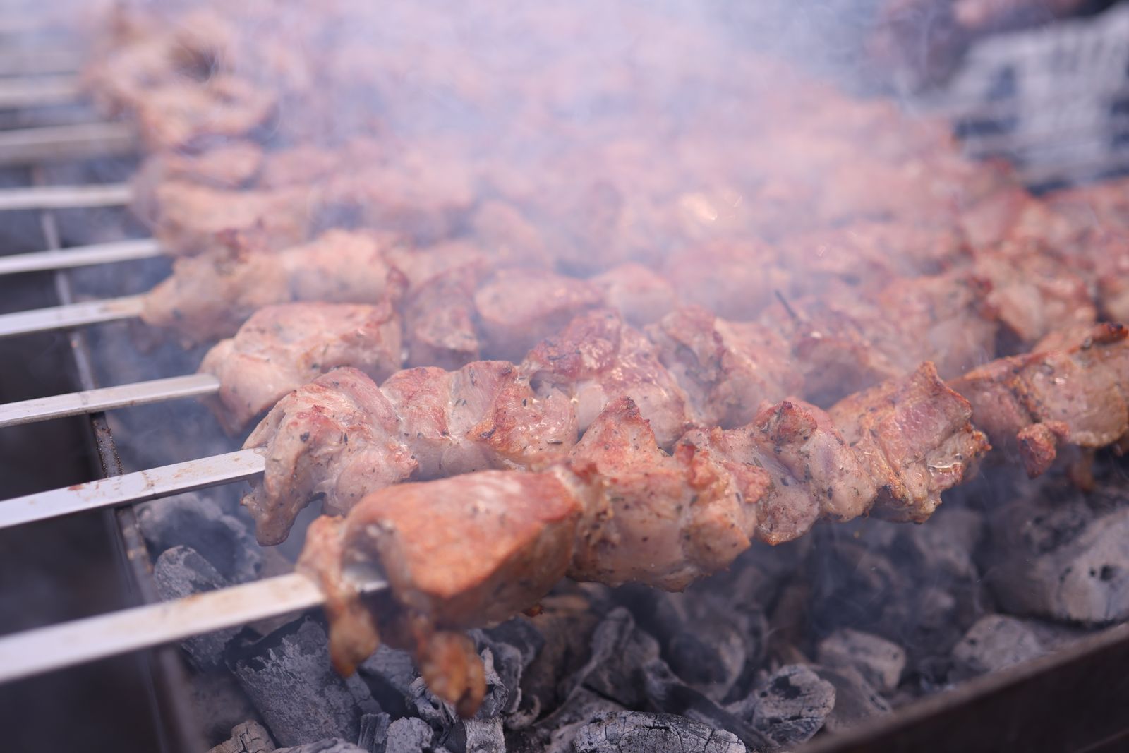 Lamb turning over the oak coals at the RiNo hearth
