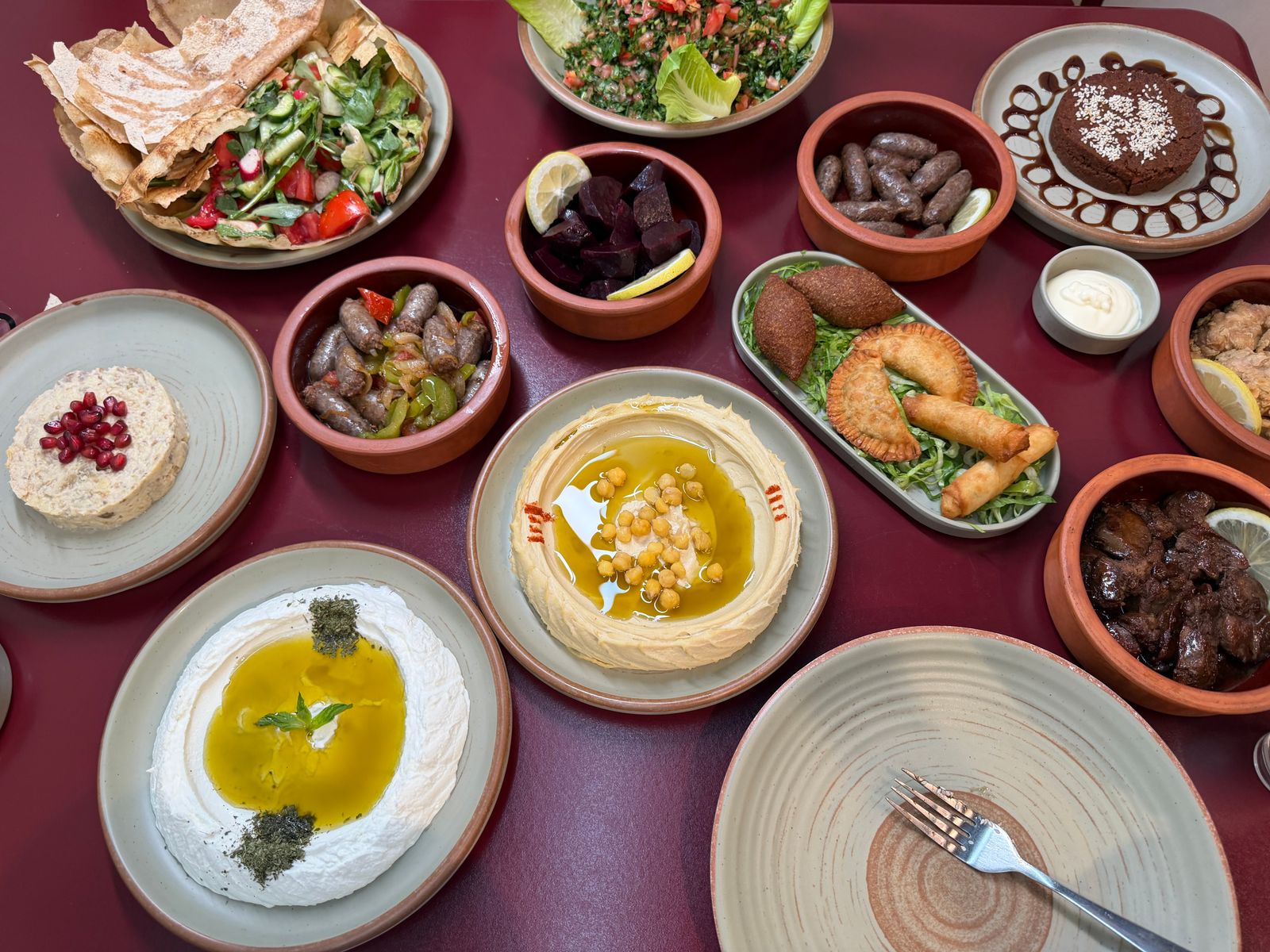 A mezze board of dips, olives and warm oven bread